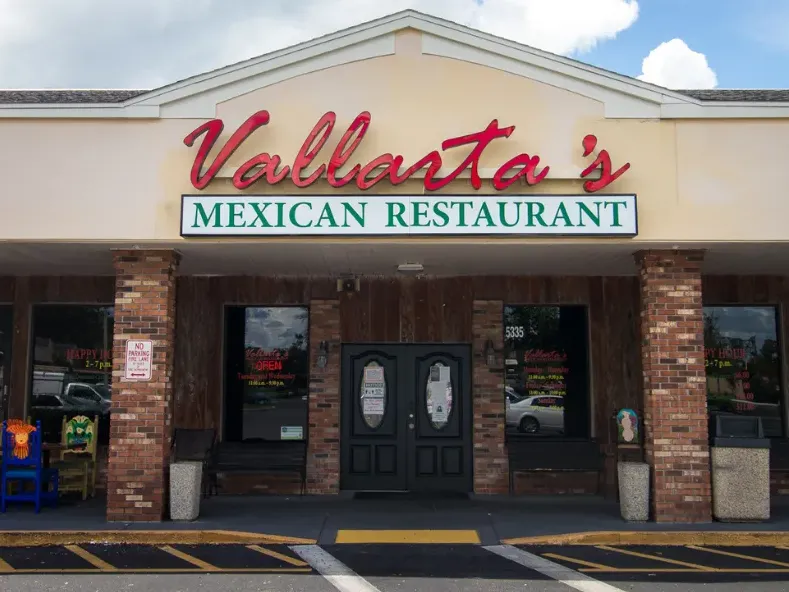 Front exterior of Vallarta’s Wesley Chapel Mexican restaurant with colorful signage and welcoming entrance